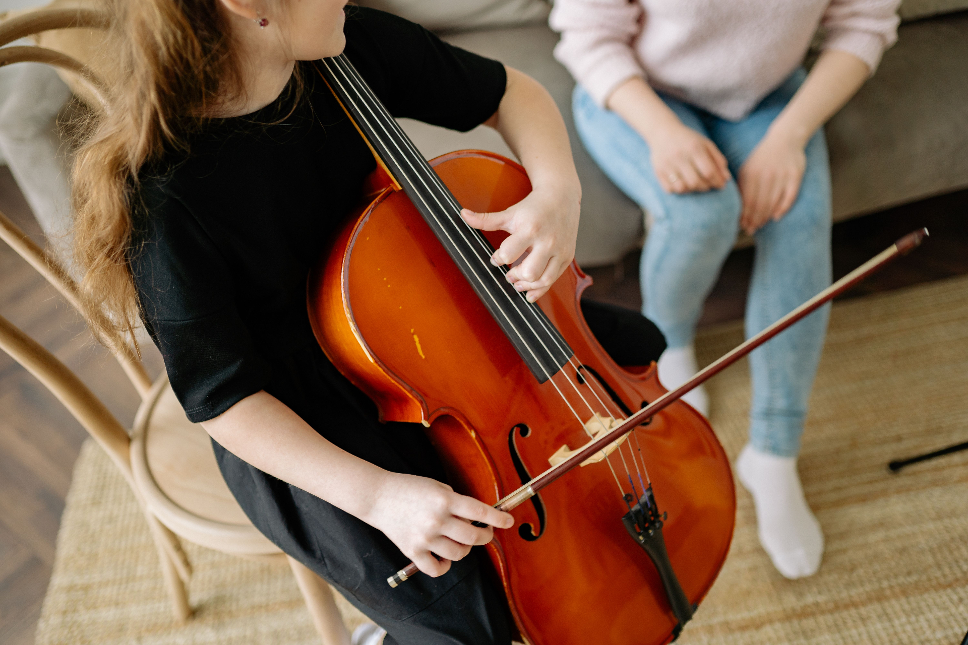 Close-up of a young violinist's hands and bow