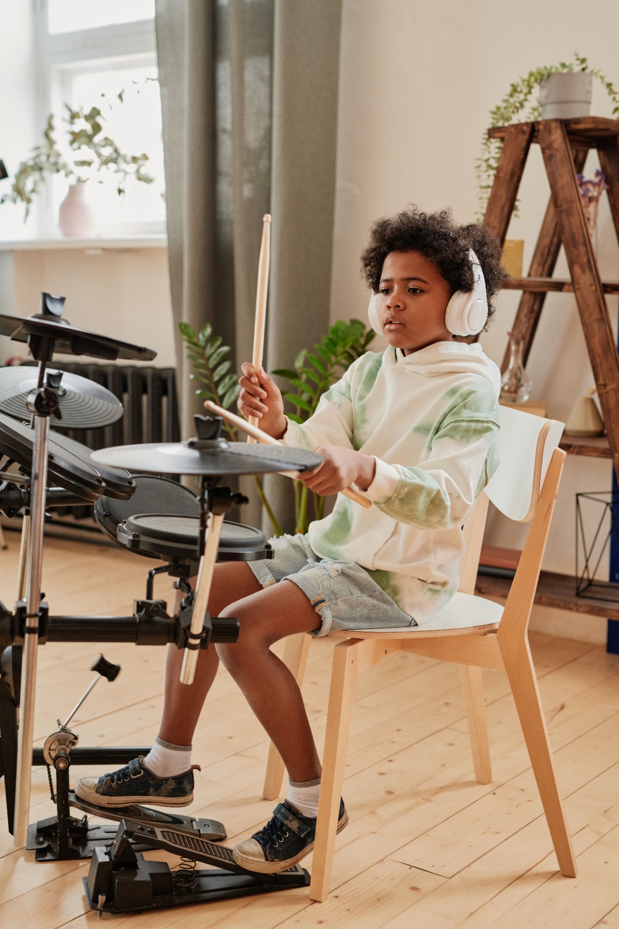 Small rock band rehearsing together in a music studio